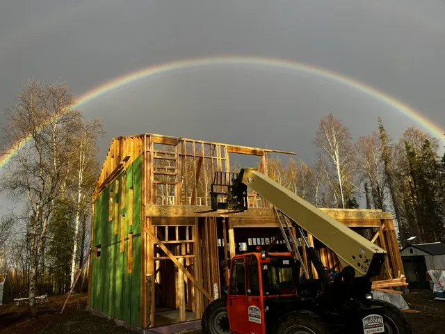 Rainbow over a home under construction near Wasilla, Alaska