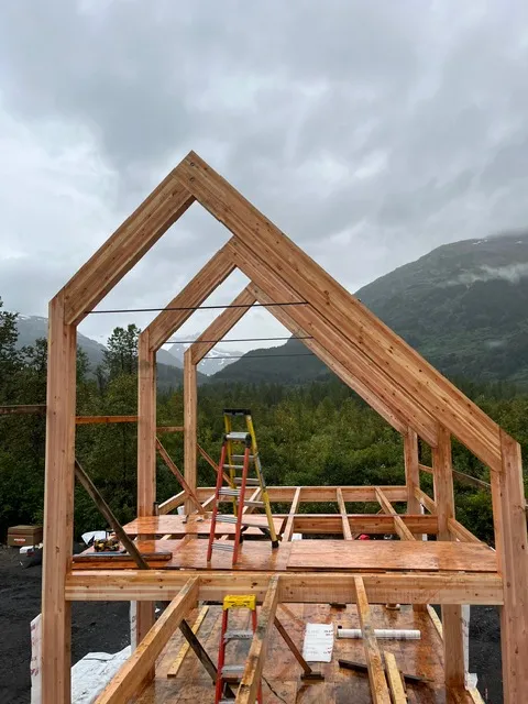 Looking up through a framed gable roof structure during a Sun Valley Construction build