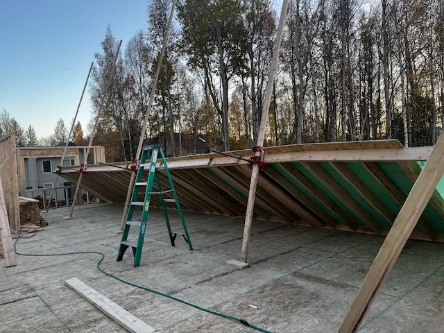 Installing roof rafters on a framed home