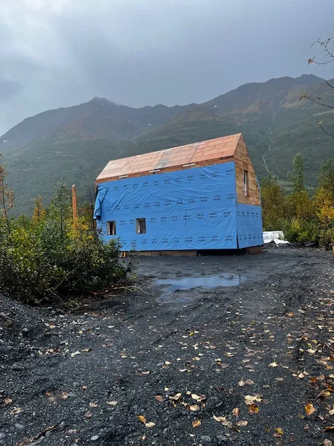 Weather-resistant barrier wrapped around a framed home shell before siding