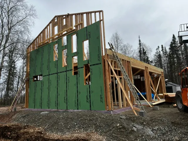 Structural sheathing installation with a telehandler on site
