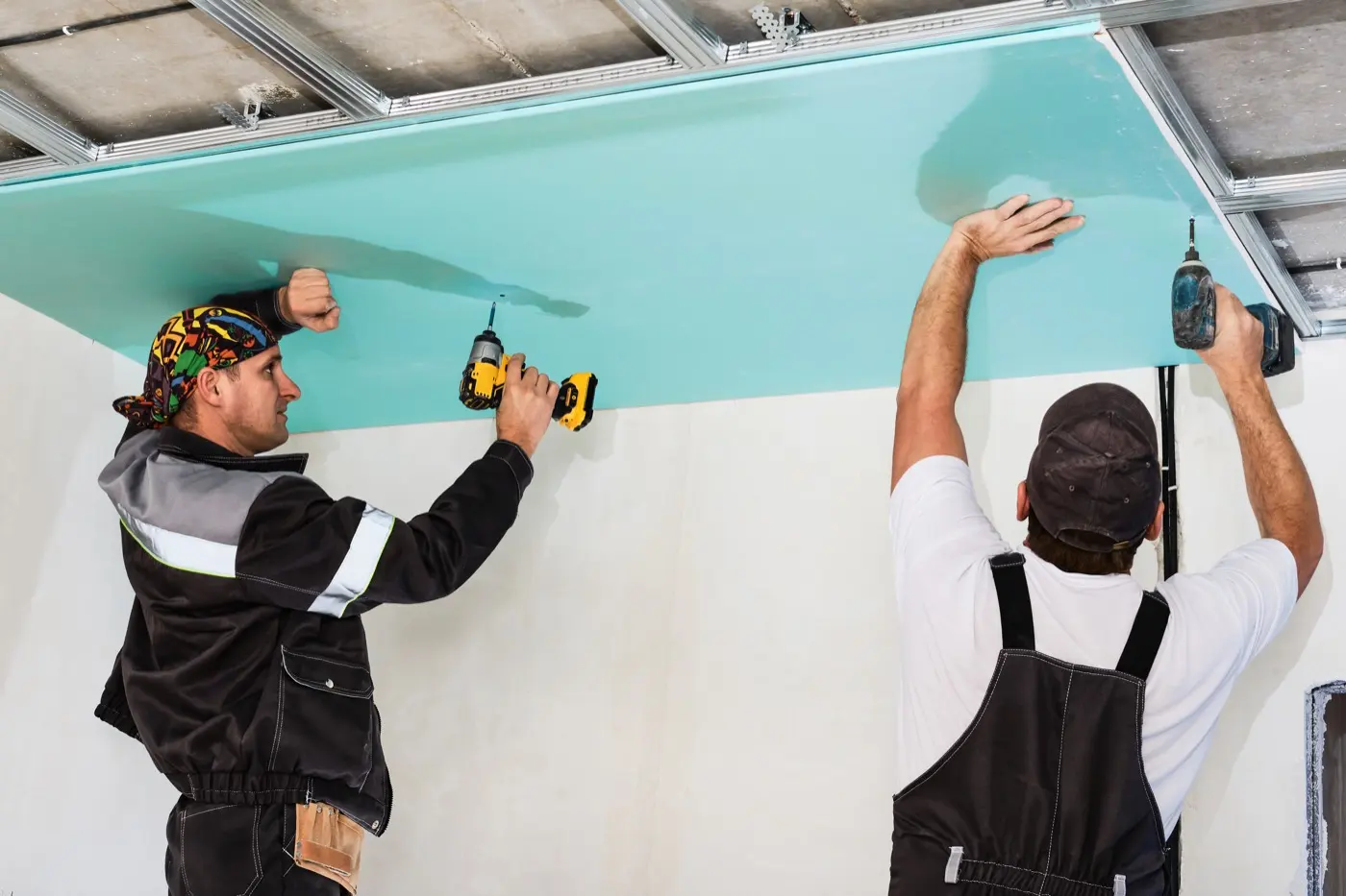 Drywall being installed inside a residential space