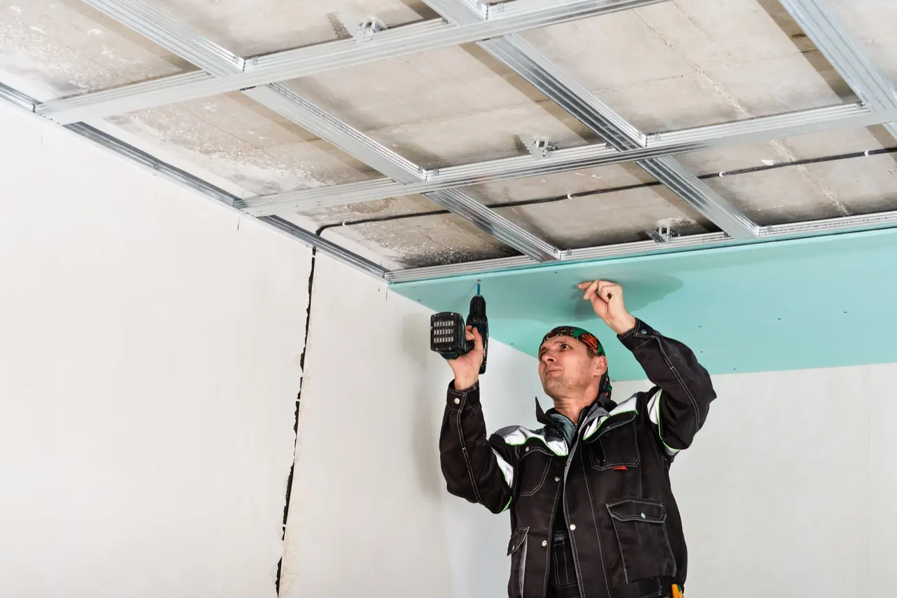 Drywall being installed inside a residential space